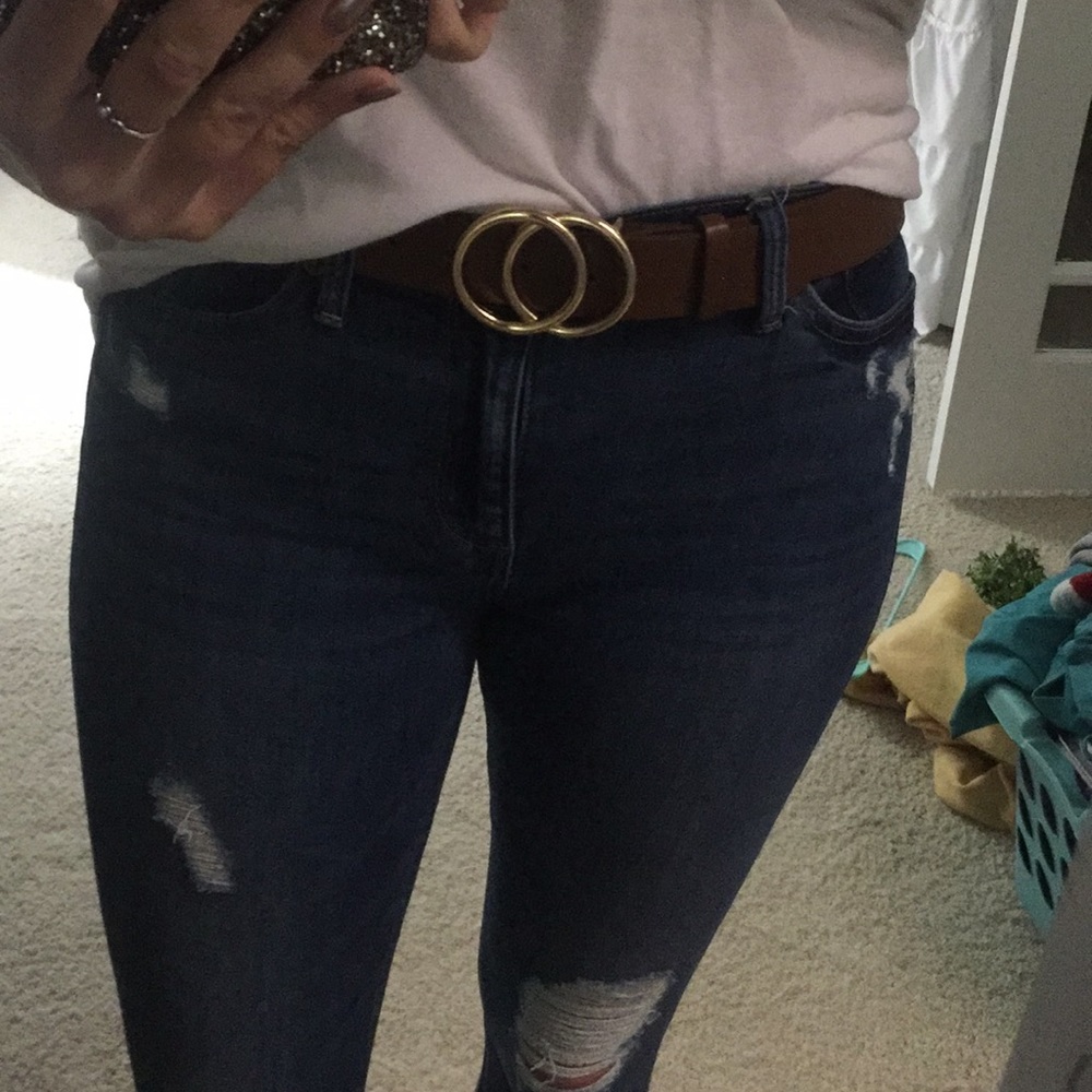 Brown belt with gold circles.